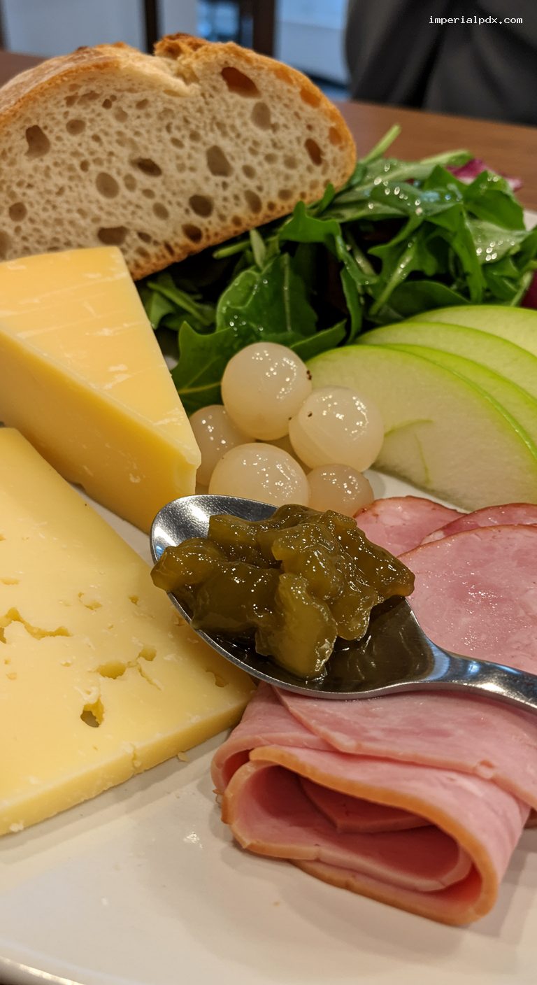 Ploughman’s Lunch Board with Cheddar, Ham, and Pickles – Closeup