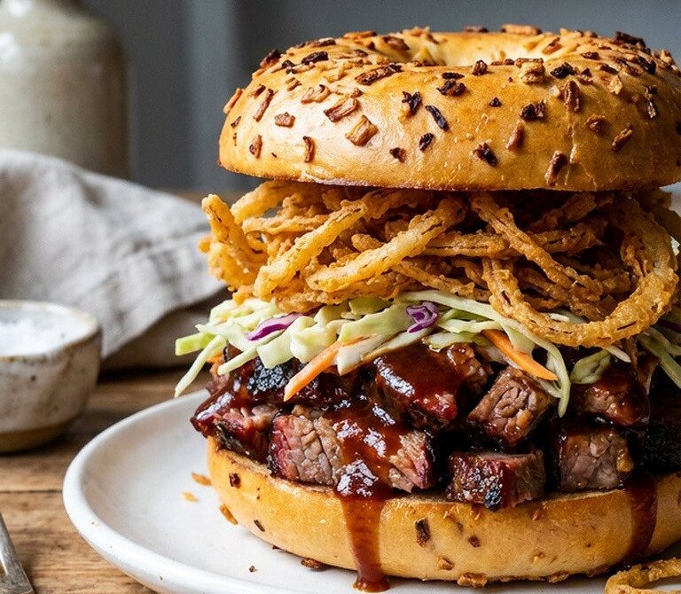 BBQ Brisket Bagel with Slaw and Crispy Onions