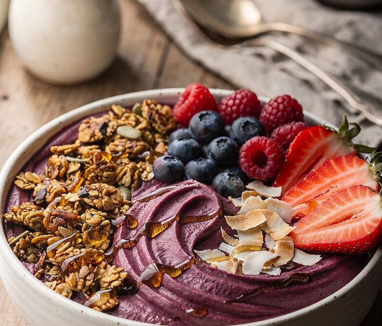 Açaí Banana Smoothie Bowl With Granola and Fresh Berries