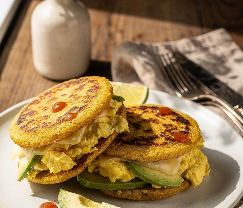 Cheesy Egg and Avocado Stuffed Arepas with Hot Sauce
