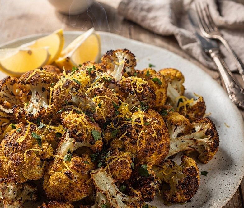 Crispy Parmesan Roasted Cauliflower With Garlic, Herbs, and Lemon Zest
