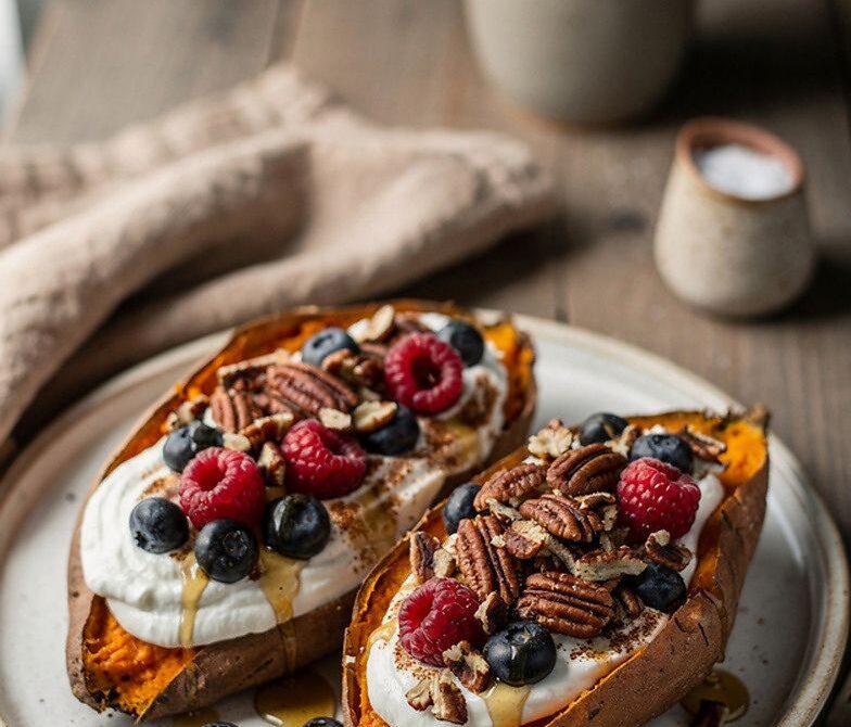 Stuffed Breakfast Sweet Potatoes With Yogurt, Berries, and Nuts