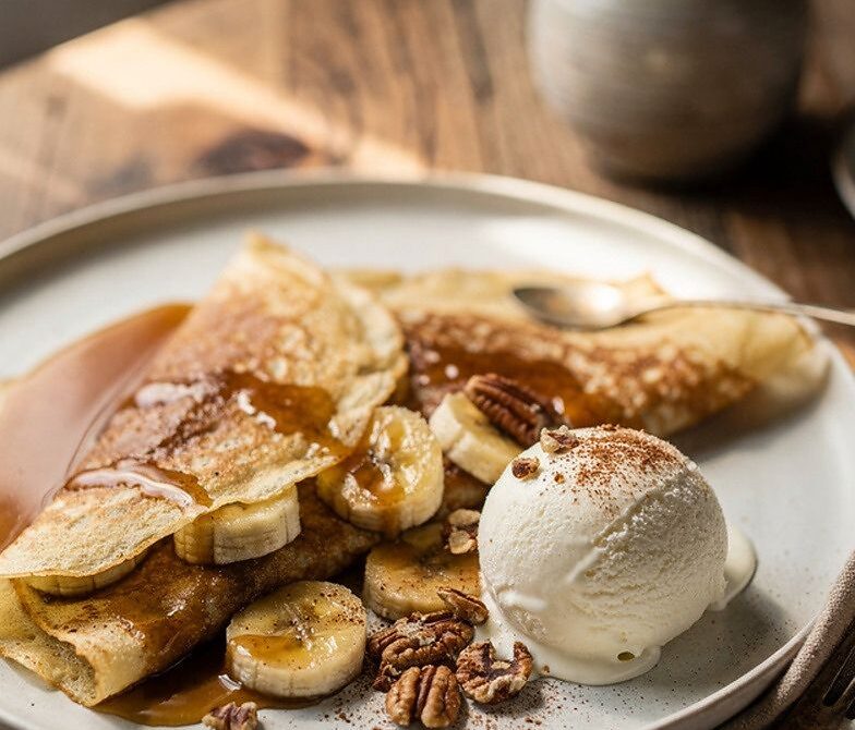Bananas Foster Crepes With Caramel Sauce and Vanilla Ice Cream