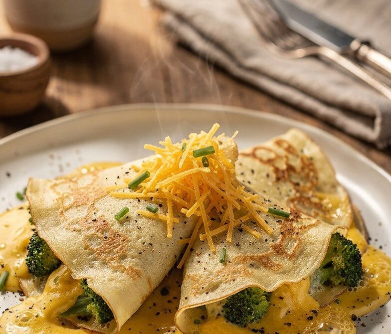 Cheddar Broccoli Cream Crepes with Bubbling Cheddar Topping