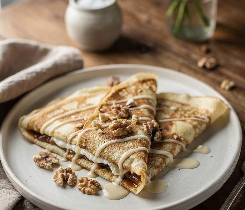 Cinnamon Roll Cream Cheese Crepes With Vanilla Glaze and Walnuts