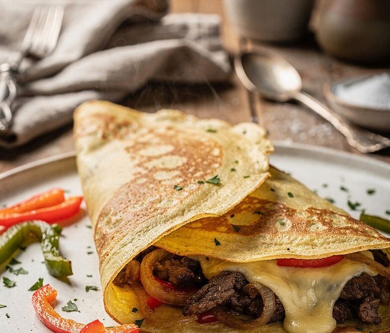 Philly Cheesesteak Crepes With Gooey Provolone and Garlic Butter
