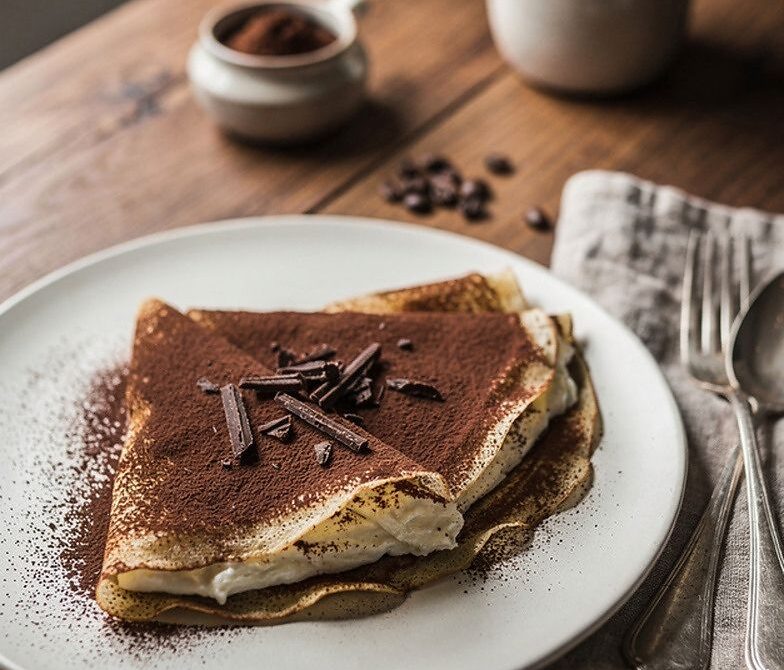 Tiramisu-Inspired Coffee Mascarpone Crepes With Cocoa Dusting