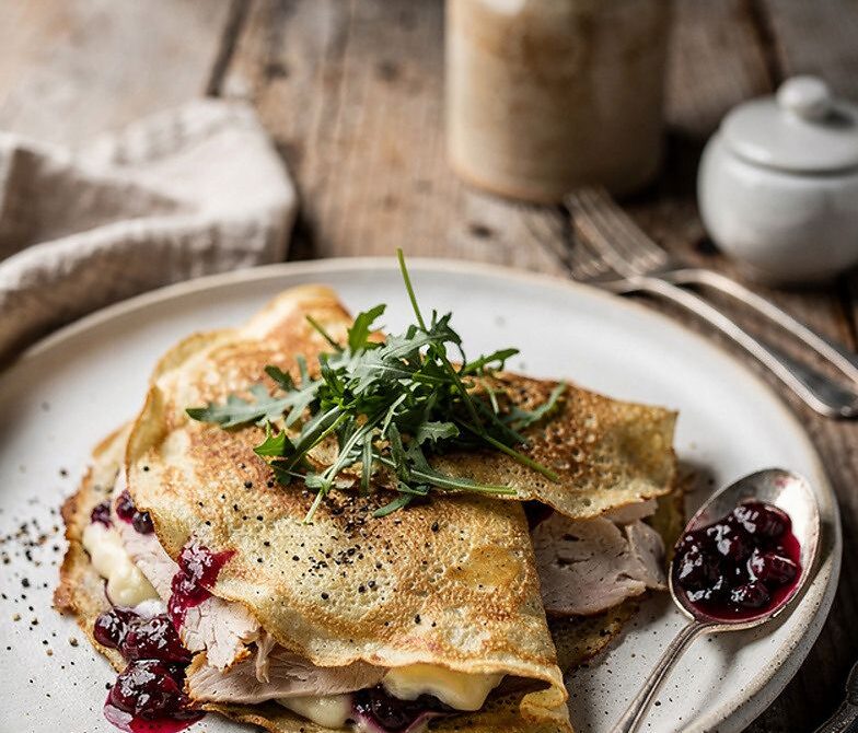 Turkey Brie Cranberry Crepes With Arugula and Cracked Pepper