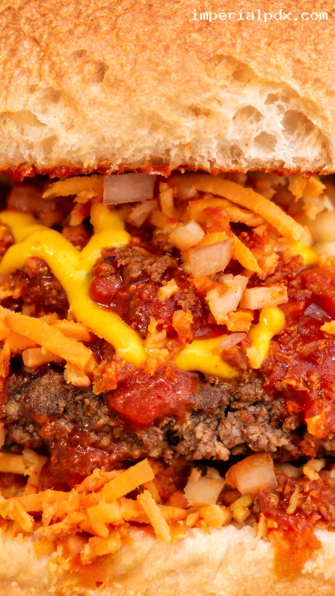 Chili Dog Burger With Cheddar and Onions – Closeup