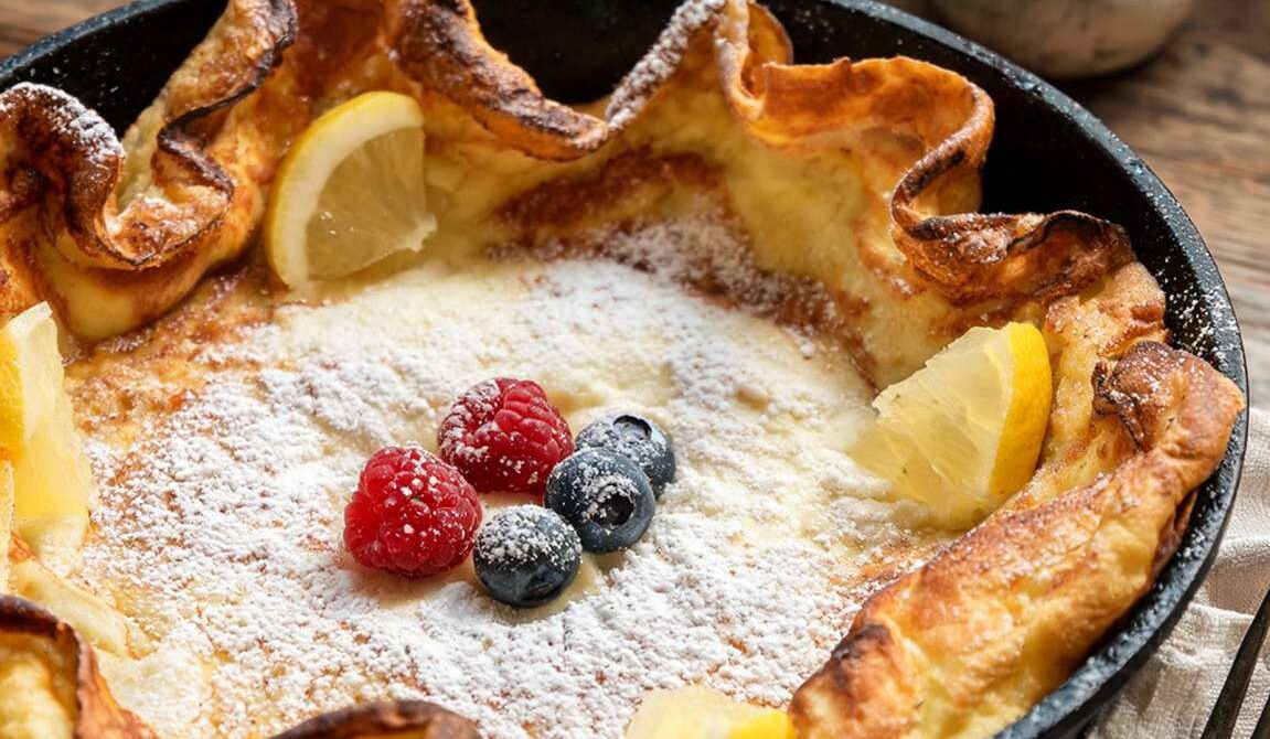 Dutch Baby Pancake With Lemon and Powdered Sugar