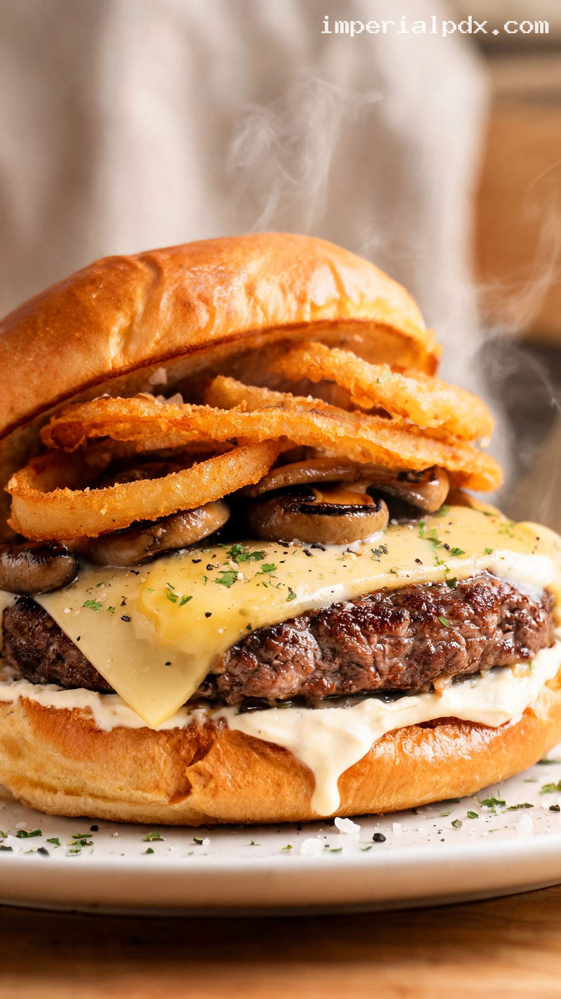 Garlic Butter Steakhouse Burger With Swiss and Crispy Onions – Closeup