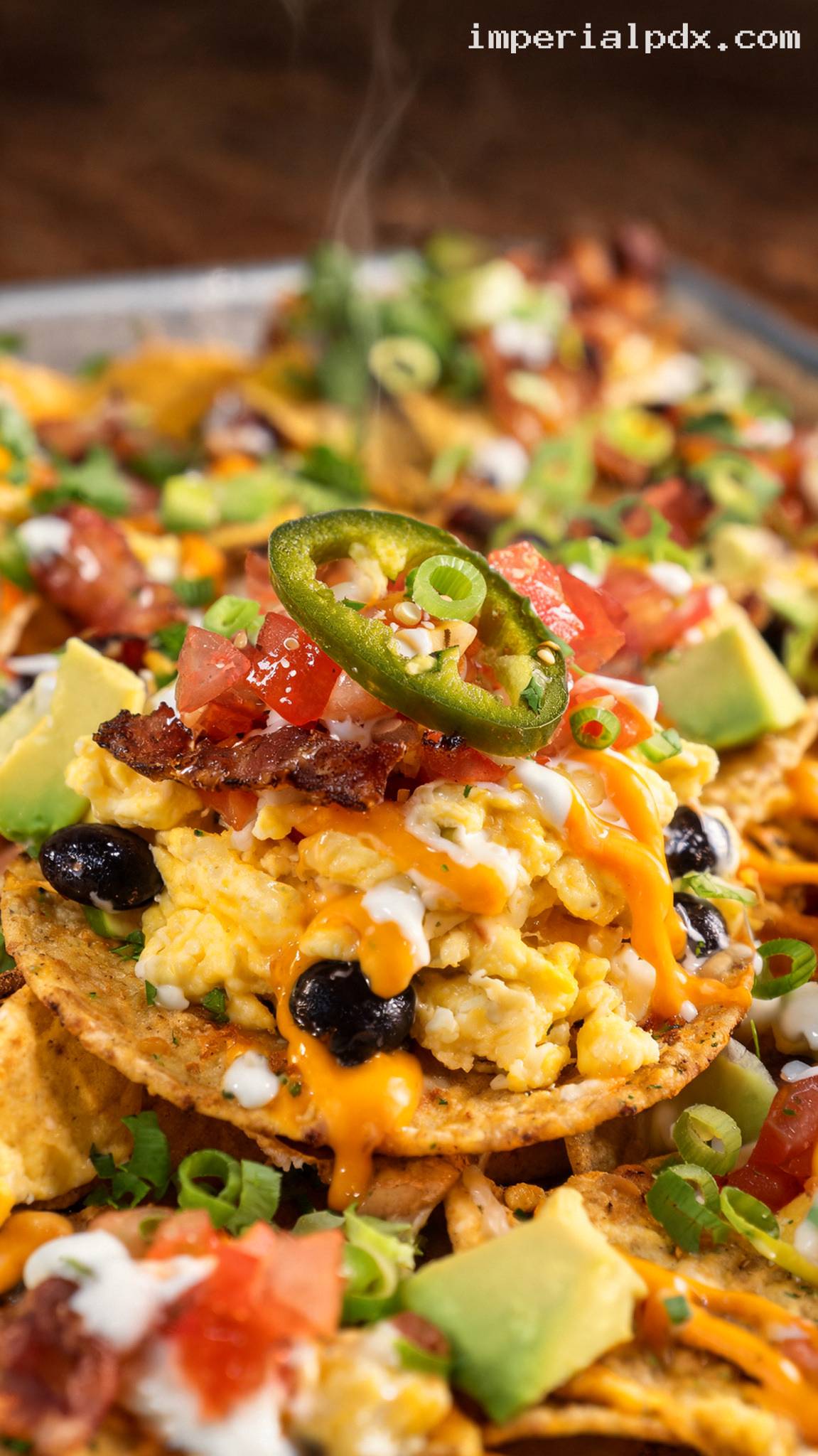 Loaded Breakfast Nachos With Eggs and Bacon – Closeup