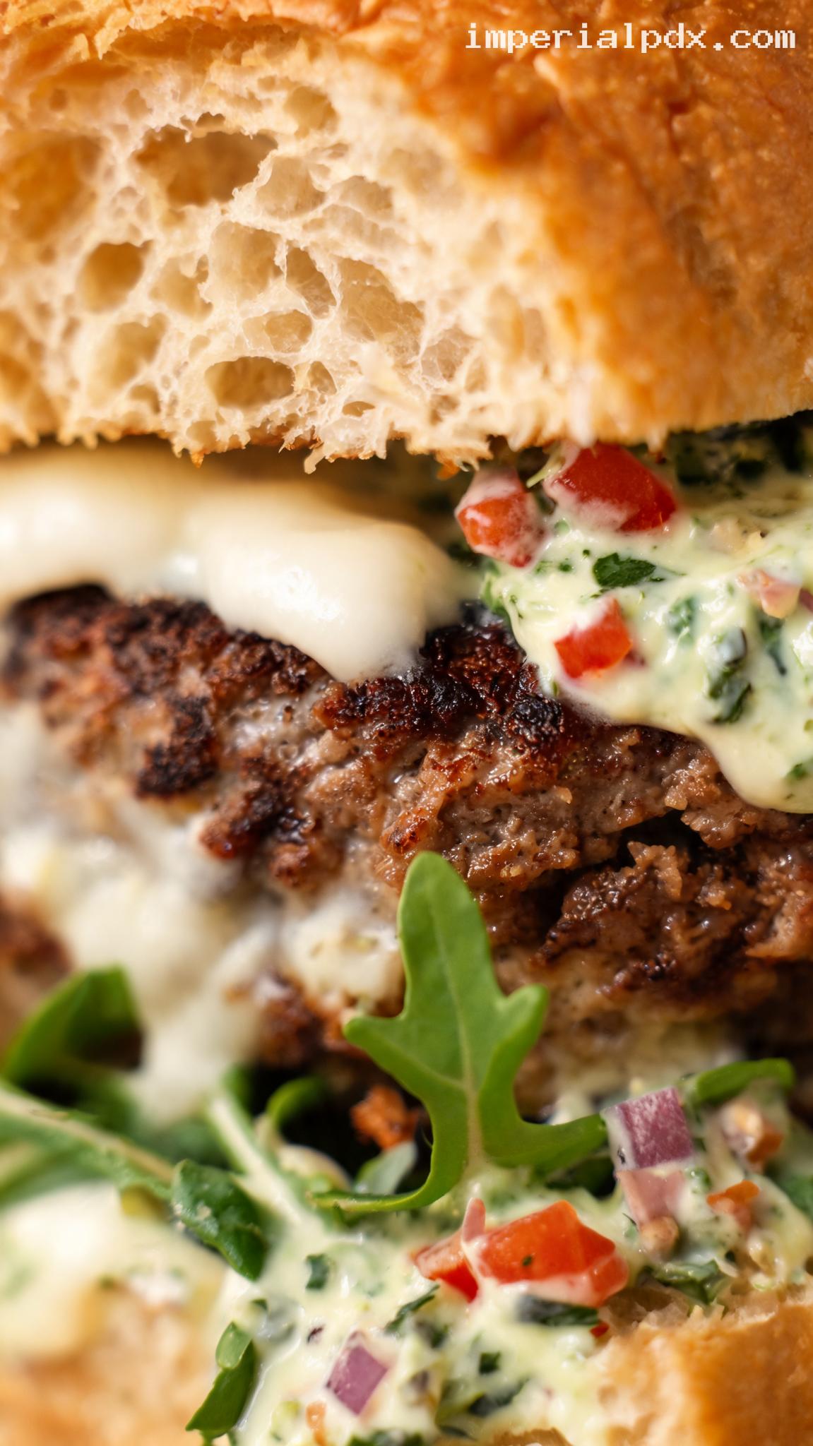 Tomato Basil Burger with Mozzarella and Peppery Greens – Closeup