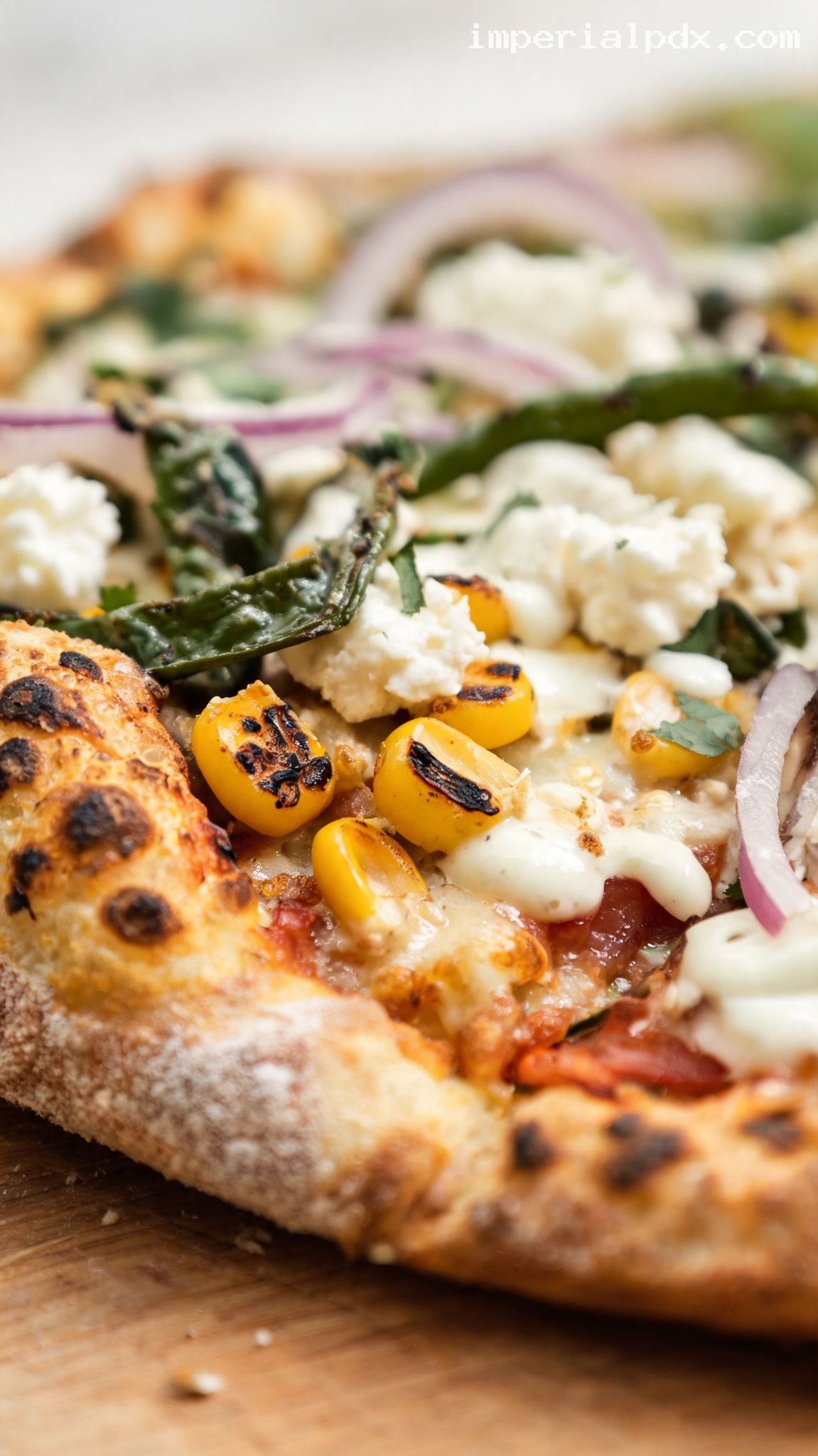 Charred Corn and Poblano Pizza with Lime Crema – Closeup