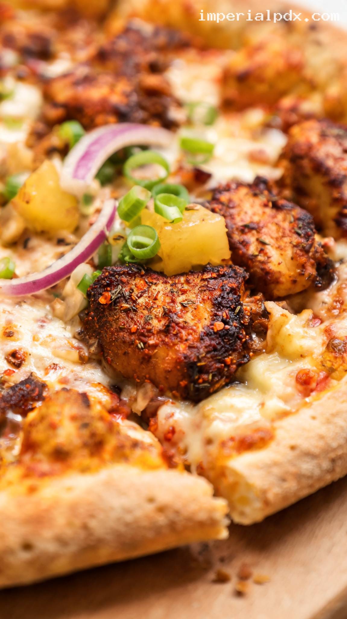Jerk Chicken Pizza with Pineapple and Red Onion – Closeup