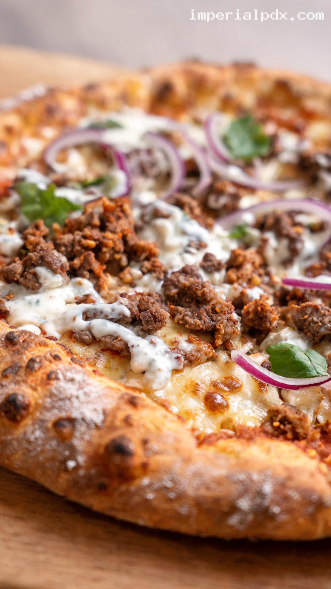 Mediterranean Lamb Pizza With Tzatziki Drizzle – Closeup