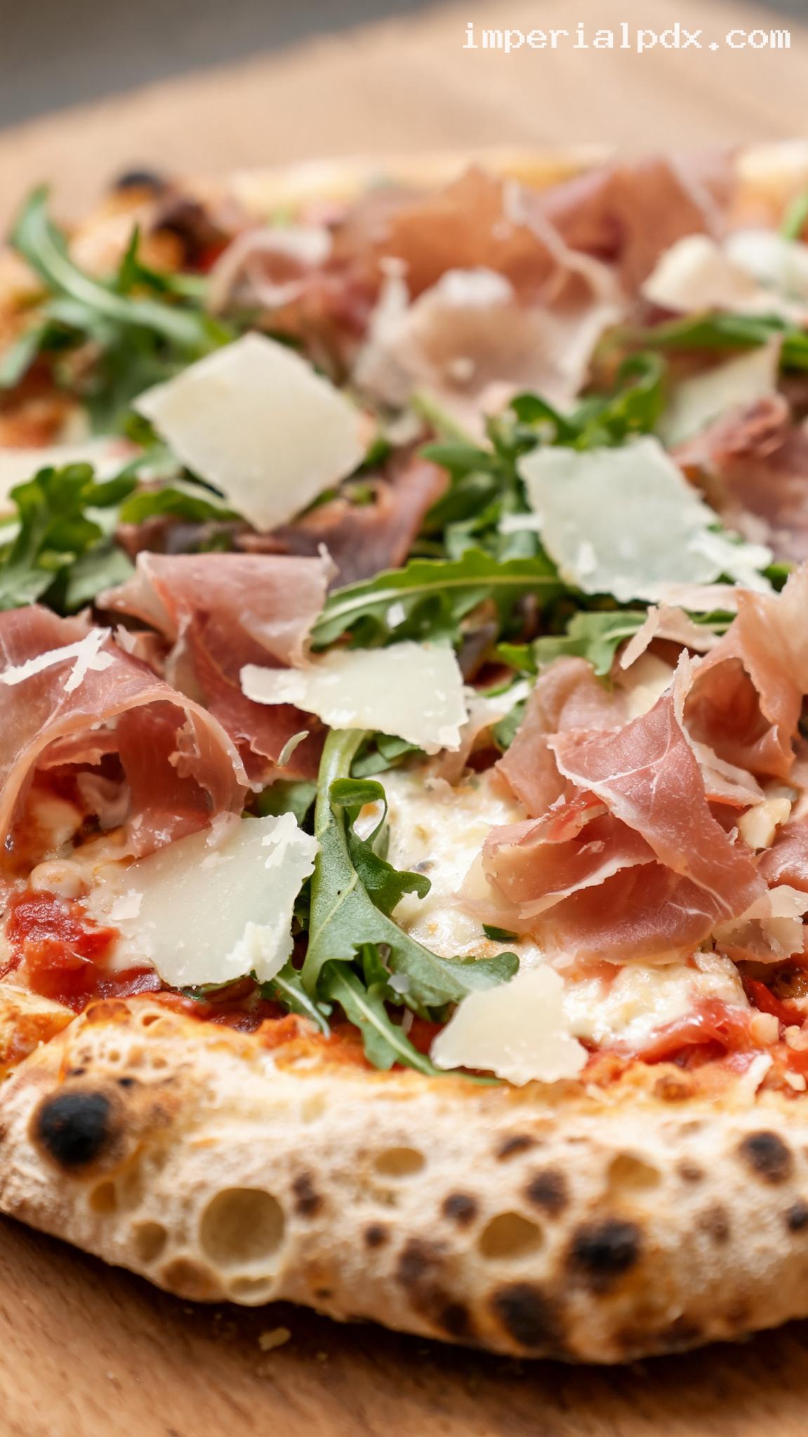 Prosciutto and Arugula Pizza With Shaved Parmesan – Closeup