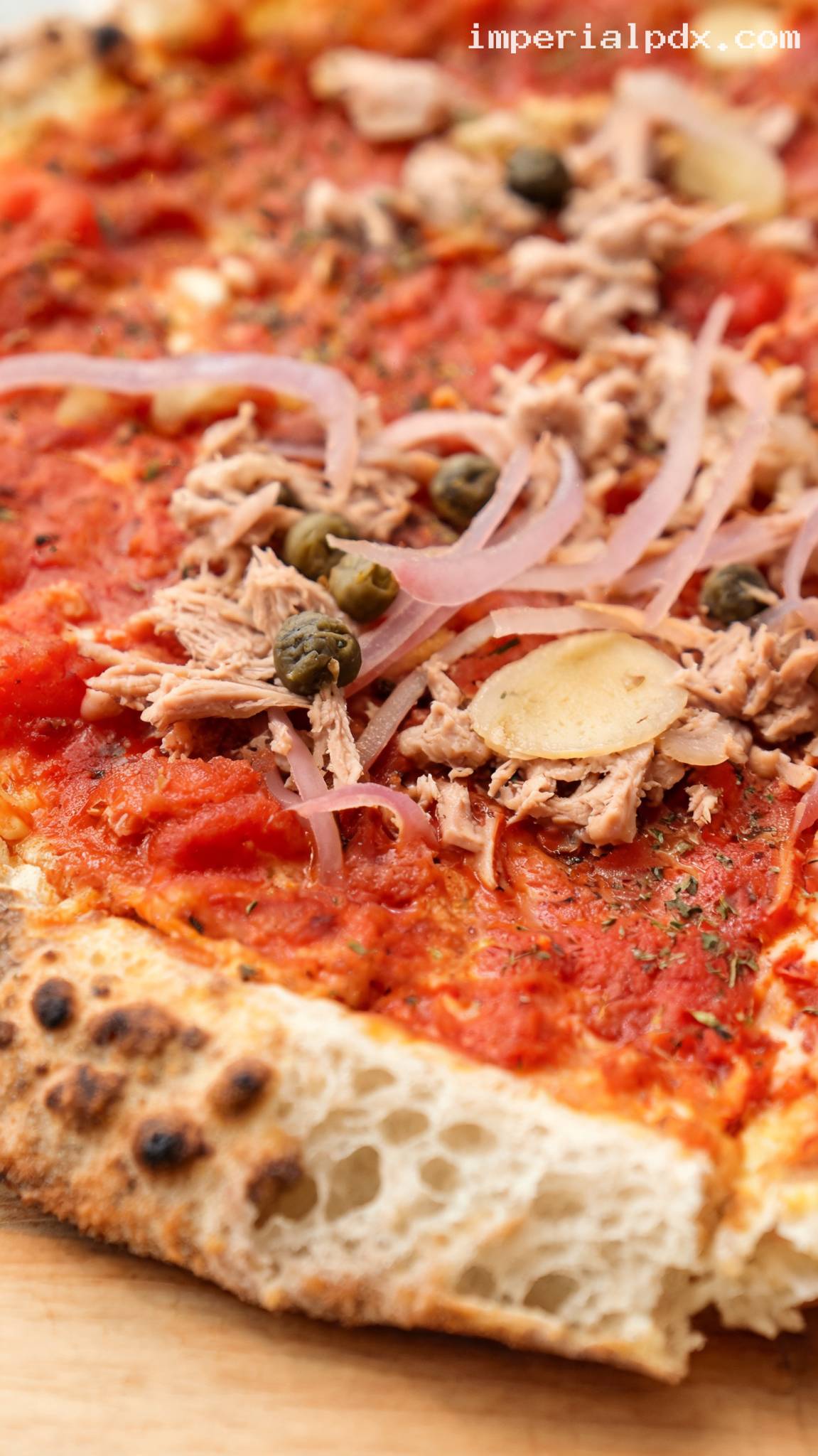 Tuna Marinara Pizza with Capers and Red Onion – Closeup