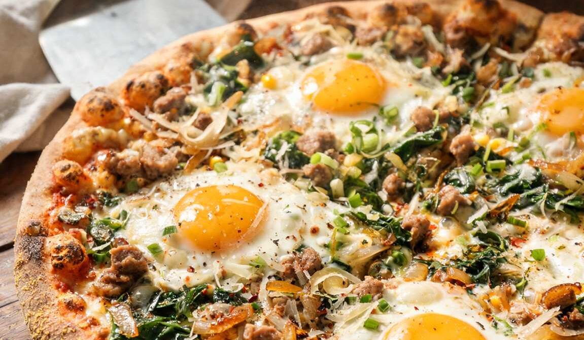Breakfast Pizza With Eggs, Sausage, and Spinach